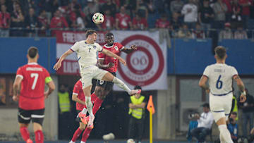 Dusan Vlahovic duelling with Spurs defender Kevin Danso