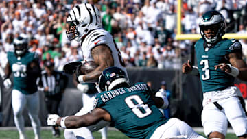 Cincinnati Bengals tight end Erick All Jr. (83) runs for a first down after a catch as Philadelphia Eagles safety C.J. Gardner-Johnson (8) goes to tackle him in the second quarter of the NFL game at Paycor Stadium in Cincinnati on Sunday, Oct. 27, 2024.