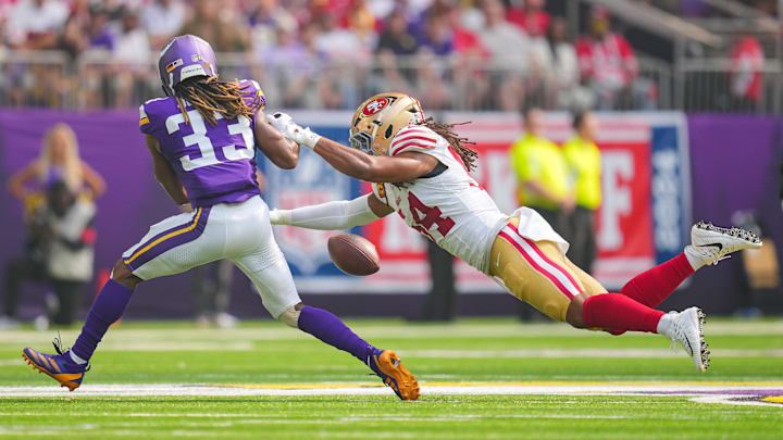 Sep 15, 2024; Minneapolis, Minnesota, USA; San Francisco 49ers linebacker Fred Warner (54) breaks up a pass to the Minnesota Vikings running back Aaron Jones (33) in the first quarter at U.S. Bank Stadium. Mandatory Credit: Brad Rempel-Imagn Images