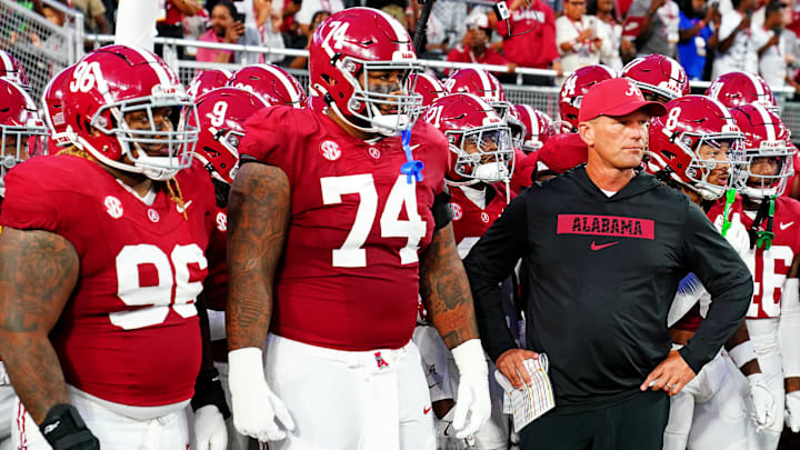 Sep 28, 2024; Tuscaloosa, Alabama, USA; Alabama Crimson Tide head coach Kalen DeBoer leads his team onto the field before the game against the Georgia Bulldogs at Bryant-Denny Stadium. Mandatory Credit: John David Mercer-Imagn Images