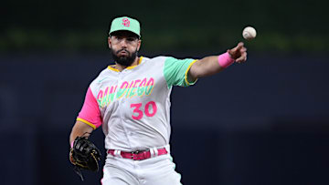 Jul 15, 2022; San Diego, California, USA; San Diego Padres first baseman Eric Hosmer (30) throws to first base on a ground out by Arizona Diamondbacks second baseman Sergio Alcantara (not pictured) during the seventh inning at Petco Park. Mandatory Credit: Orlando Ramirez-Imagn Images