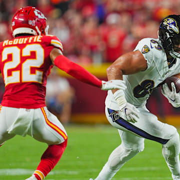 Sep 5, 2024; Kansas City, Missouri, USA; Baltimore Ravens tight end Mark Andrews (89) runs with the ball against Kansas City Chiefs cornerback Trent McDuffie (22) during the first half at GEHA Field at Arrowhead Stadium. Mandatory Credit: Jay Biggerstaff-Imagn Images