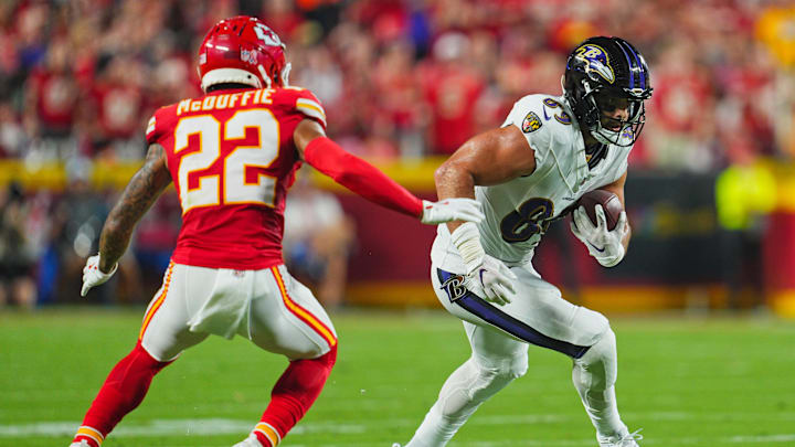 Sep 5, 2024; Kansas City, Missouri, USA; Baltimore Ravens tight end Mark Andrews (89) runs with the ball against Kansas City Chiefs cornerback Trent McDuffie (22) during the first half at GEHA Field at Arrowhead Stadium. Mandatory Credit: Jay Biggerstaff-Imagn Images