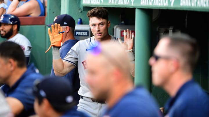 Aug 10, 2024; Boston, Massachusetts, USA;  Houston Astros first baseman Zach Dezenzo (9) is ignored by his teammates in the dugout after hitting a home run during the eighth inning against the Boston Red Sox at Fenway Park. 