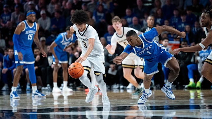 Vanderbilt Commodores guard Tyler Tanner (3) heads up court after stealing the ball from Kentucky Wildcats guard Lamont Butler (1) during their game at Memorial Gym in Nashville, Tenn., Saturday, Jan. 25, 2025.