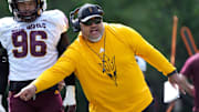ASU offensive line coach Saga Tuitele runs a drill as the team holds their first day of practice at Camp Tontozona on Aug. 6, 2025.
