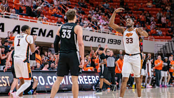 Feb 25, 2025; Stillwater, Oklahoma, USA; Oklahoma State Cowboys forward Abou Ousmane (33) reacts after a play during the second half against the Iowa State Cyclones at Gallagher-Iba Arena. Mandatory Credit: William Purnell-Imagn Images