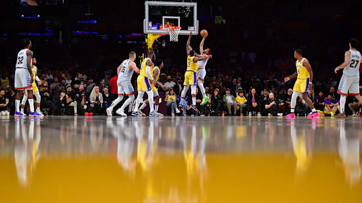 May 22, 2023; Los Angeles, California, USA; Denver Nuggets forward Bruce Brown (11) shoots the ball against Los Angeles Lakers center Tristan Thompson (9) during the fourth quarter in game four of the Western Conference Finals for the 2023 NBA playoffs at Crypto.com Arena. Mandatory Credit: Gary A. Vasquez-Imagn Images