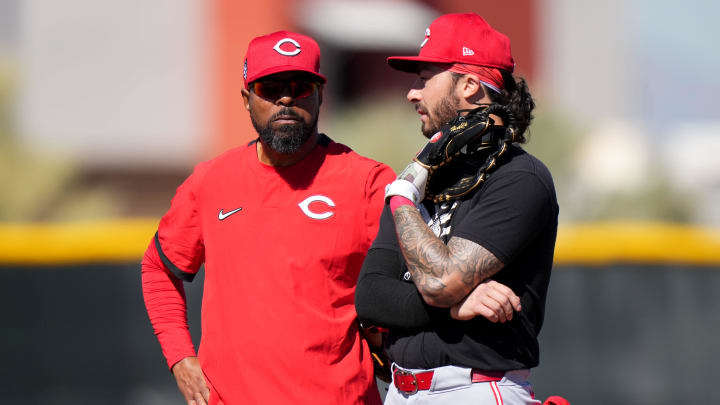 Cincinnati Reds special assistant Barry Larkin talks with infielder Jonathan India during spring training workouts, Monday, Feb. 19, 2024, at the team's spring training facility in Goodyear, Ariz.