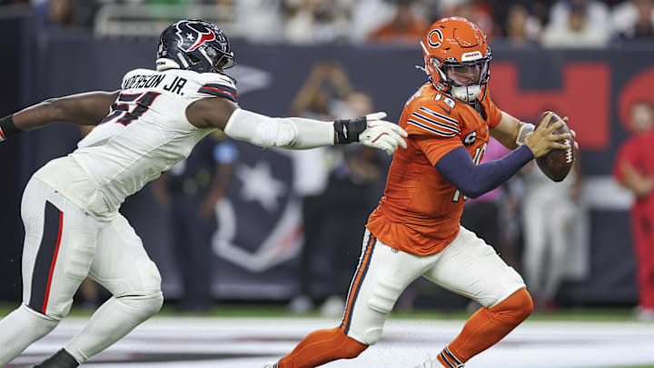 Sep 15, 2024; Houston, Texas, USA; Chicago Bears quarterback Caleb Williams (18) attempts to evade the tackle of Houston Texans defensive end Will Anderson Jr. (51) during the third quarter at NRG Stadium. Mandatory Credit: Troy Taormina-Imagn Images