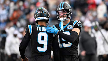 Nov 24, 2024; Charlotte, North Carolina, USA; Carolina Panthers quarterback Bryce Young (9) with wide receiver Adam Thielen (19) on the field in the fourth quarter at Bank of America Stadium. Mandatory Credit: Bob Donnan-Imagn Images