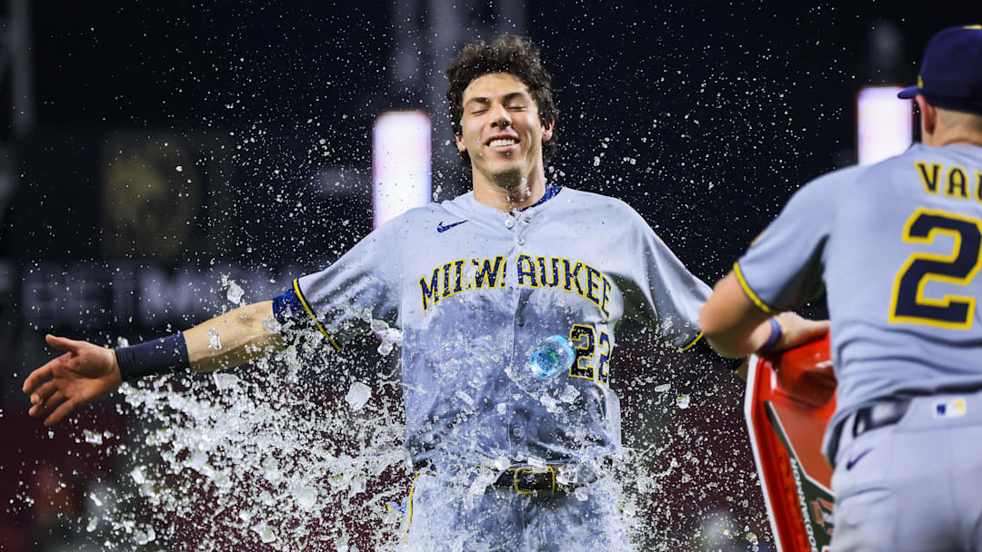 Milwaukee Brewers first baseman Andrew Vaughn dumps water on designated hitter Christian Yelich after the victory over the Cincinnati Reds at Great American Ball Park.
