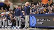 West Virginia Mountaineers head coach Darian DeVries calls out a play during the first half against the UCF Knights at WVU Coliseum. Nick Norton, one of the assistant coaches added to DeVries' Indiana staff, is standing in the background.