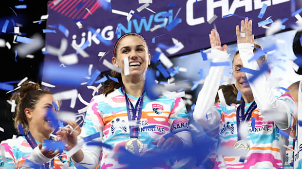 San Diego Wave FC celebrates with teammates after winning the 2024 Challenge Cup.