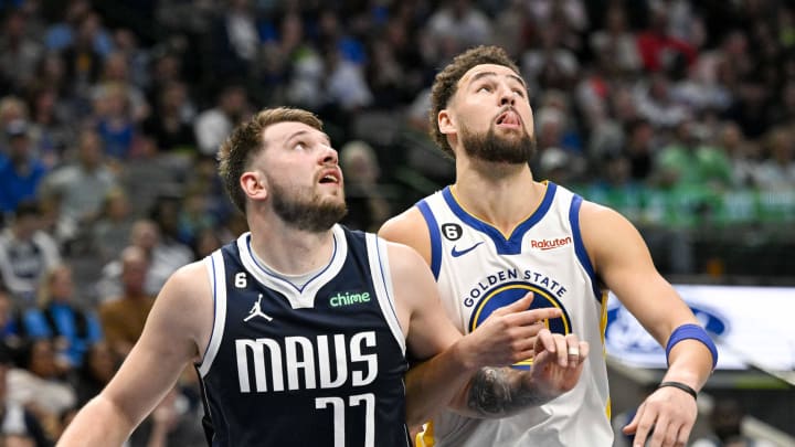 Mar 22, 2023; Dallas, Texas, USA; Dallas Mavericks guard Luka Doncic (77) and Golden State Warriors guard Klay Thompson (11) in action during the game between the Dallas Mavericks and the Golden State Warriors at the American Airlines Center. Mandatory Credit: Jerome Miron-USA TODAY Sports