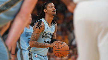 Apr 15, 2025; San Francisco, California, USA; Memphis Grizzlies guard Ja Morant (12) shoots a free throw against the Golden State Warriors in the second quarter at the Chase Center.