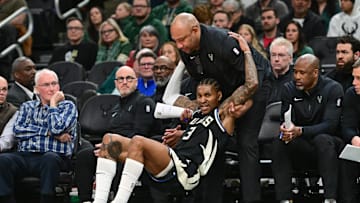 Milwaukee Bucks assistant coach Darlin Ham helps guard Kevin Porter Jr. up in the fourth quarter against the New Orleans Pelicans at Fiserv Forum on Thursday.