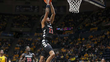 Feb 19, 2025; Morgantown, West Virginia, USA; Cincinnati Bearcats forward Dillon Mitchell (23) dunks the ball during the second half against the West Virginia Mountaineers at WVU Coliseum. Mandatory Credit: Ben Queen-Imagn Images