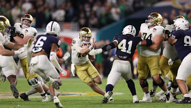 Notre Dame QB Riley Leonard runs the ball against Penn State in the Orange Bow
