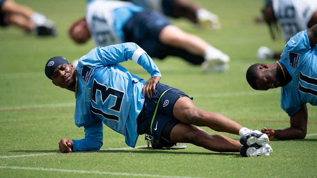 Tennessee Titans James Proche II stretches during OTAs at Ascension Saint Thomas Sports Park in Nashville, Tenn., Wednesday, May 28, 2025.