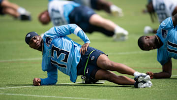 Tennessee Titans James Proche II stretches during OTAs at Ascension Saint Thomas Sports Park in Nashville, Tenn., Wednesday, May 28, 2025.