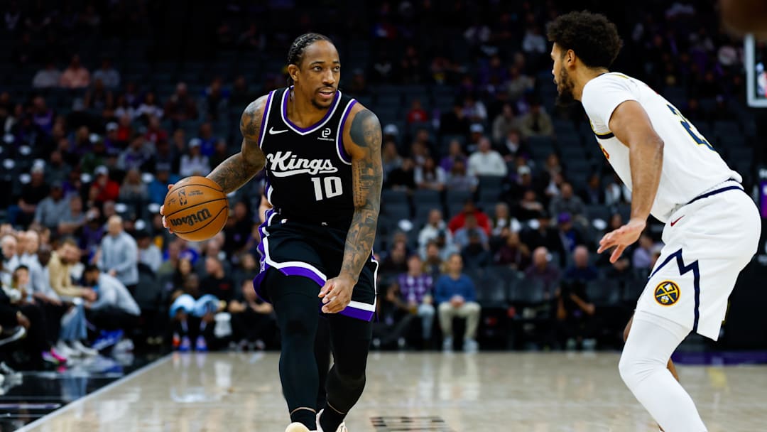 Dec 11, 2025; Sacramento, California, USA; Sacramento Kings guard Demar Derozan (10) controls the ball during the first quarter against Denver Nuggets forward Cameron Johnson (23) at Golden 1 Center. Mandatory Credit: Sergio Estrada-Imagn Images