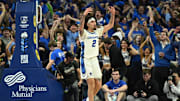 Dec 4, 2024; Omaha, Nebraska, USA; Creighton Bluejays guard Pop Isaacs (2) reacts to the crowd after making a three point basket against the Kansas Jayhawks during the second half at CHI Health Center Omaha. Mandatory Credit: Steven Branscombe-Imagn Images