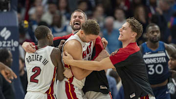 Nov 10, 2024; Minneapolis, Minnesota, USA; Miami Heat forward Nikola Jovic (5) (middle) celebrates with teammates after defeating the Minnesota Timberwolves at Target Center. 