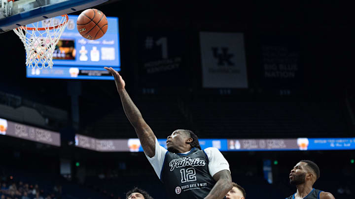 La Familia's Eric Bledsoe (12) goes for a layup during their game against the 305 Ballers on Friday, July 19, 2024 in Lexington, Ky. at Rupp Arena during the first round of The Basketball Tournament.