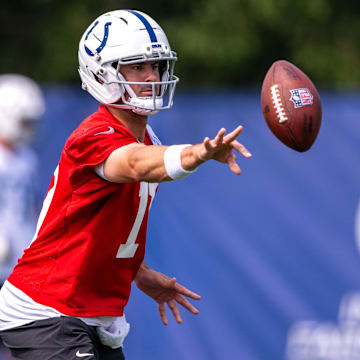 Jun 12, 2025; Indianapolis, IN, USA; Indianapolis Colts quarterback Daniel Jones (17) pitches a ball during training camp at the Farm Bureau Football complex. Mandatory Credit: Marc Lebryk-Imagn Images
