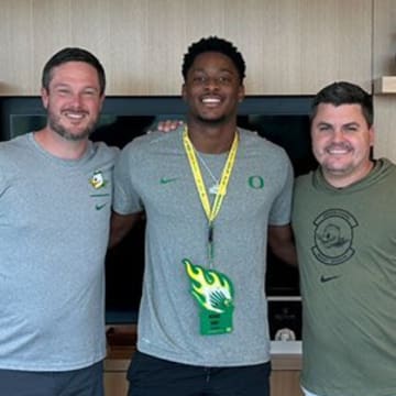 Oregon Ducks coach Dan Lanning with five-star recruit Michael Terry III. Oregon is battling the Texas Longhorns for Terry III's commitment. 