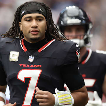 Nov 24, 2024; Houston, Texas, USA; Houston Texans quarterback C.J. Stroud (7) runs onto the field before playing against the Tennessee Titans at NRG Stadium. Mandatory Credit: Thomas Shea-Imagn Images