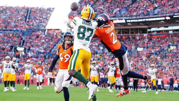 Green Bay Packers wide receiver Romeo Doubs (87) pulls in a touchdown past Denver Broncos cornerback Pat Surtain II (2).