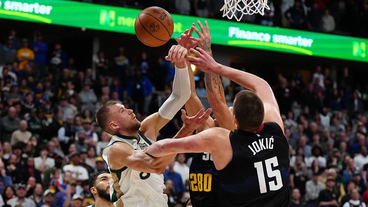 Mar 7, 2024; Denver, Colorado, USA; Boston Celtics center Kristaps Porzingis (8) goes for a shot against the Denver Nuggets