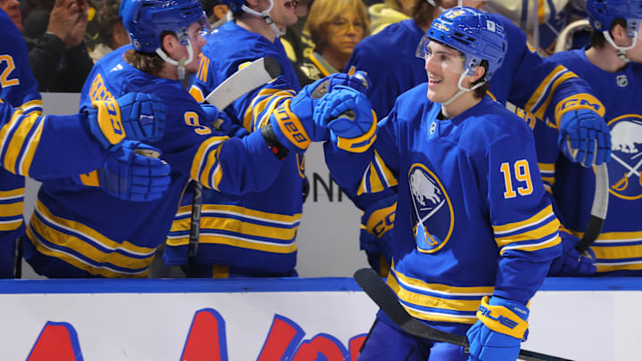 Mar 27, 2025; Buffalo, New York, USA;  Buffalo Sabres center Peyton Krebs (19) celebrates his goal with teammates during the first period against the Pittsburgh Penguins at KeyBank Center. Mandatory Credit: Timothy T. Ludwig-Imagn Images