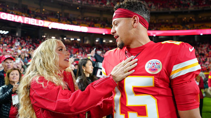 Kansas City Chiefs quarterback Patrick Mahomes (15) greets wife, Brittany Mahomes, during warmups prior to the game against the Washington Commanders at GEHA Field at Arrowhead Stadium.