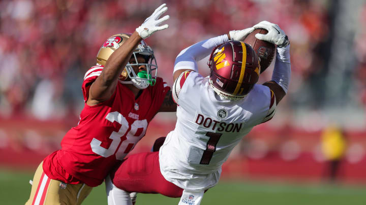 Dec 24, 2022; Santa Clara, California, USA; Washington Commanders wide receiver Jahan Dotson (1) makes a catch against San Francisco 49ers cornerback Deommodore Lenoir (38) during the second quarter. The play got called back due to penalties on both teams during the second quarter at Levi's Stadium. Mandatory Credit: Sergio Estrada-USA TODAY Sports