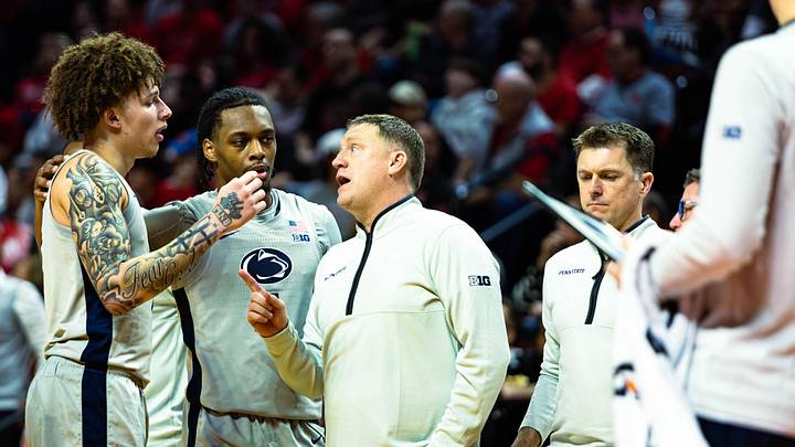 Penn State men's basketball head coach Mike Rhoades talks to Dominick Stewart (left) and Kayden Mingo during a timeout against Rutgers inside Jersey Mike's Arena in Piscataway, New Jersey on March 8, 2026.