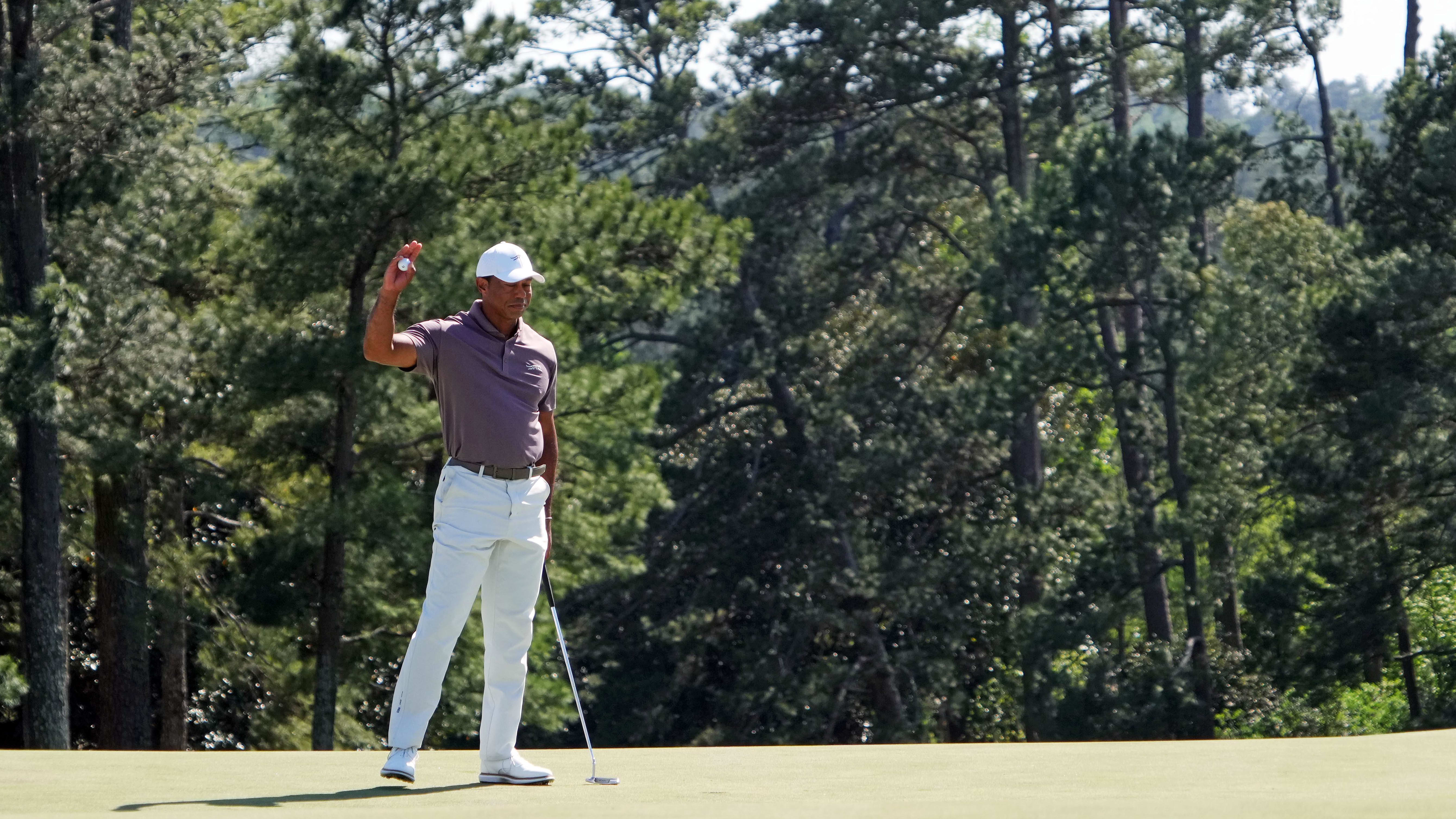 Tiger Woods waves to the patrons during his second-round 72 at the 2024 Masters.