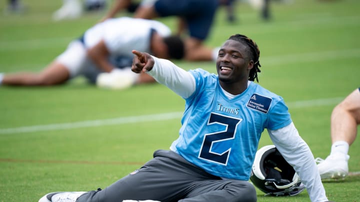 Running back Tyjae Spears (2) jokes with a coach during the Tennessee Titans mandatory mini-camp at Ascension Saint Thomas Sports Park in Nashville, Tenn., Wednesday, June 5, 2024.