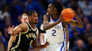 Oct 24, 2025; Lexington, KY, USA; Kentucky Wildcats guard Jasper Johnson (2) handles the ball guarded by Purdue Boilermakers guard C.J. Cox (0) during the first half at Rupp Arena at Central Bank Center. Mandatory Credit: Jordan Prather-Imagn Images