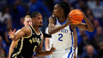 Oct 24, 2025; Lexington, KY, USA; Kentucky Wildcats guard Jasper Johnson (2) handles the ball guarded by Purdue Boilermakers guard C.J. Cox (0) during the first half at Rupp Arena at Central Bank Center. Mandatory Credit: Jordan Prather-Imagn Images