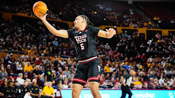 Mar 8, 2025; Tempe, Arizona, USA; Texas Tech Red Raiders forward Darrion Williams (5) rebounds the ball against the Arizona State Sun Devils at Desert Financial Arena. Mandatory Credit: Arianna Grainey-Imagn Images
