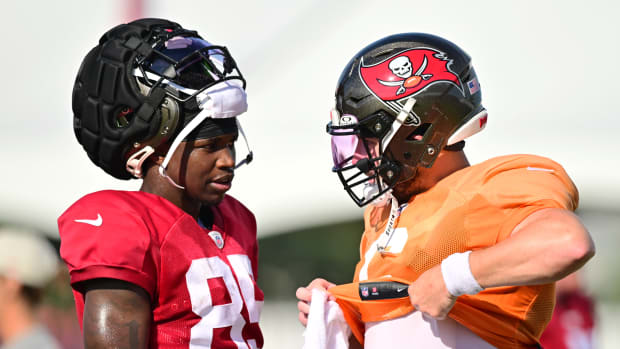 Baker Mayfield #6 talks with Latreal Jones #85 of the Tampa Bay Buccaneers during training camp 