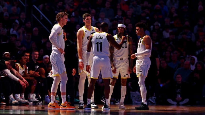 Feb 8, 2024; Phoenix, Arizona, USA; Utah Jazz guard Kris Dunn (11) talks to his team during the first quarter of the game against the Phoenix Suns at Footprint Center. Mandatory Credit: Mark J. Rebilas-USA TODAY Sports