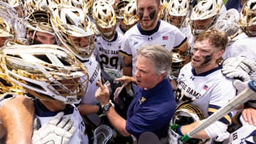 Notre Dame head coach Kevin Corrigan talks with his team after a semifinal victory against Denver at Lincoln Financial.