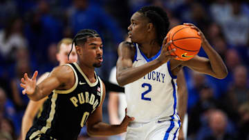 Oct 24, 2025; Lexington, KY, USA; Kentucky Wildcats guard Jasper Johnson (2) handles the ball guarded by Purdue Boilermakers guard C.J. Cox (0) during the first half at Rupp Arena at Central Bank Center. Mandatory Credit: Jordan Prather-Imagn Images