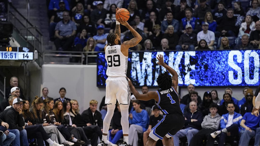 Feb 24, 2026; Provo, Utah, USA; UCF Knights forward Jordan Burks (99) takes a three point shot during the first half against the BYU Cougars at Marriott Center. Mandatory Credit: Aaron Baker-Imagn Images Feb 24, 2026; Provo, Utah, USA; UCF Knights forward Jordan Burks (99) takes a three point shot during the first half against the BYU Cougars at Marriott Center. Mandatory Credit: Aaron Baker-Imagn Images