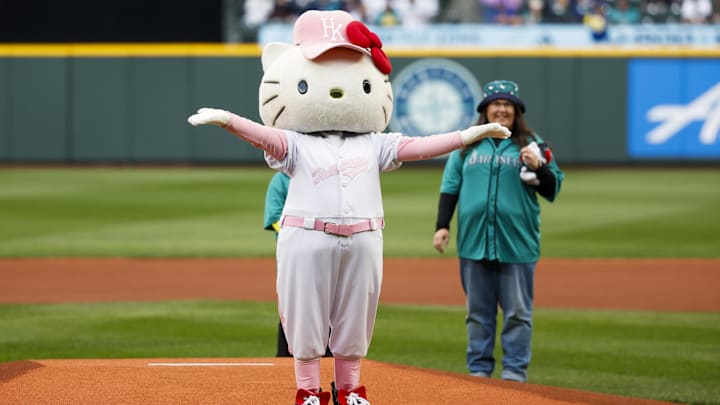 Mar 29, 2025; Seattle, Washington, USA; The Hello Kitty mascot reacts after throwing out the first pitch before a game between the Athletics and Seattle Mariners at T-Mobile Park. Mandatory Credit: Joe Nicholson-Imagn Images