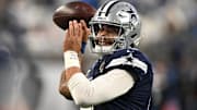 Dallas Cowboys quarterback Dak Prescott warms up before a game against the Detroit Lions at Ford Field.